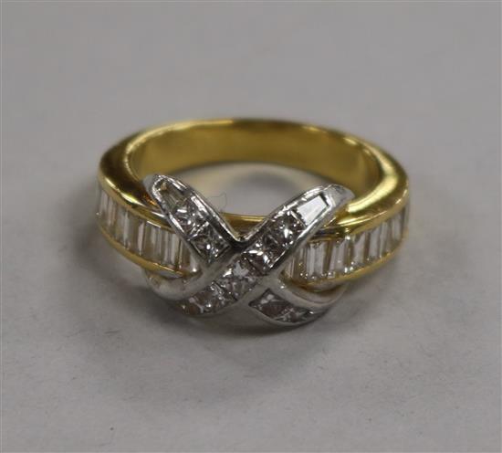 A modern 18ct gold, baguette and princess cut diamond dress ring with central X motif, size M.